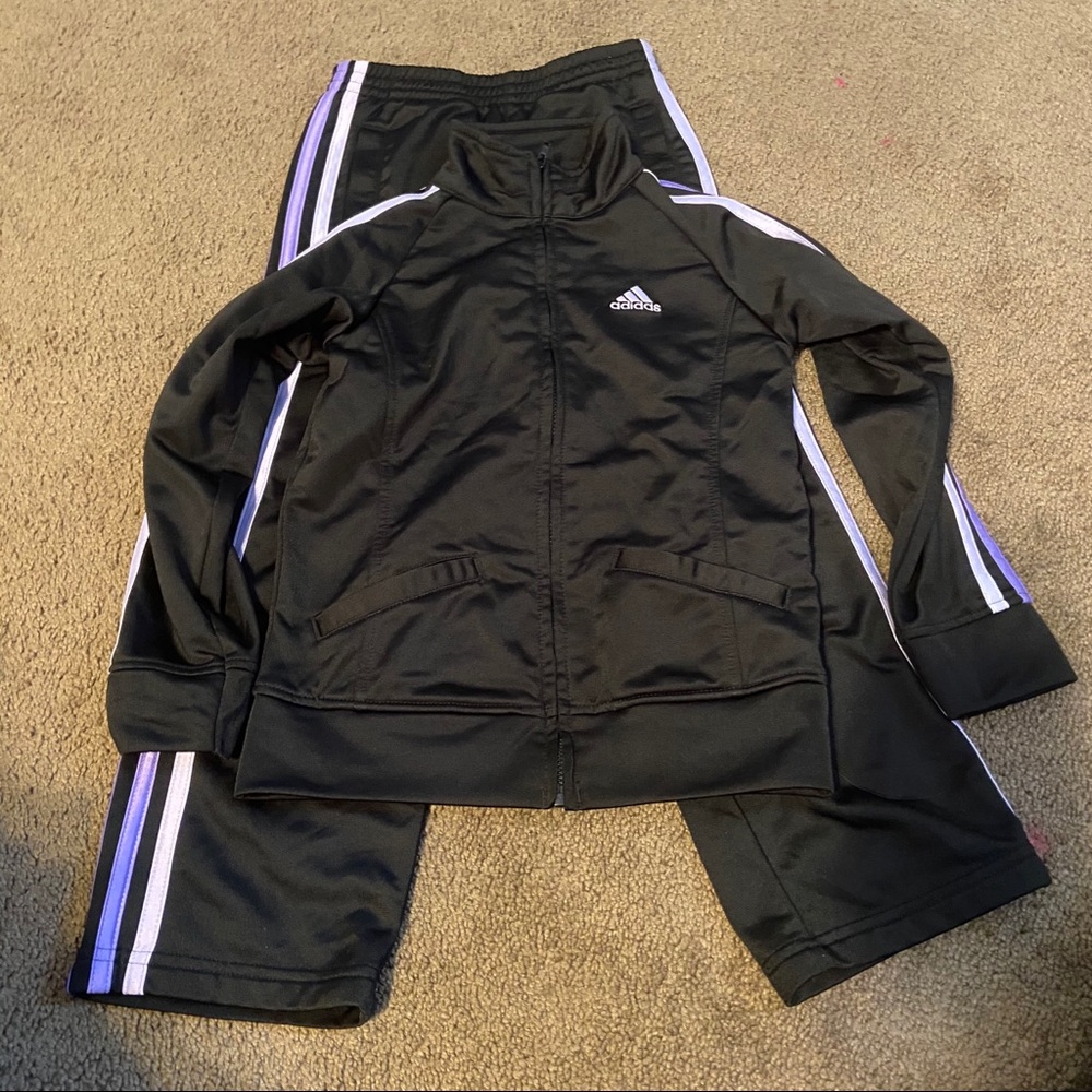 Adidas track suit girls size 6. Black and purple